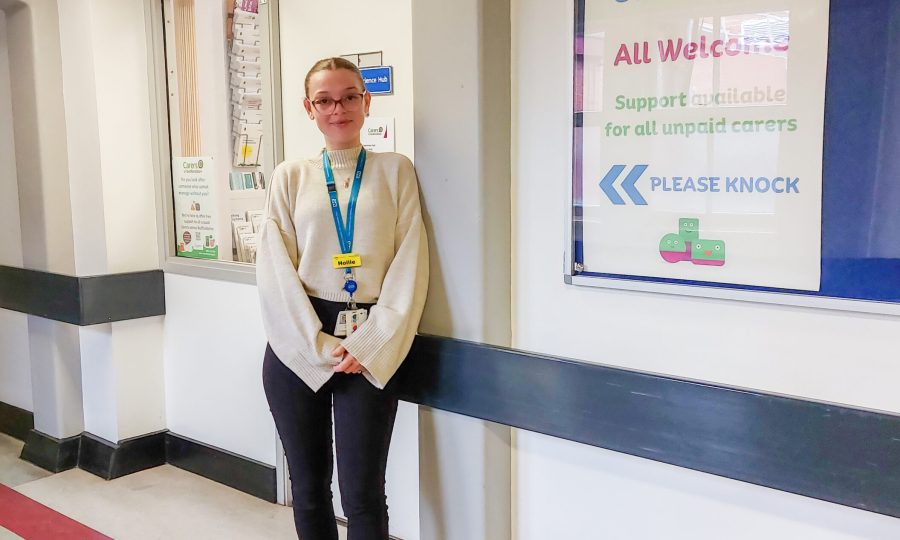 A Support worker standing outside Carers Hub at Bedford Hospital